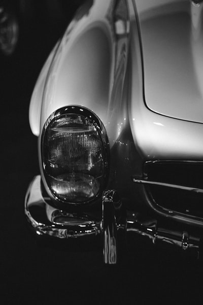 grayscale photo of car headlight